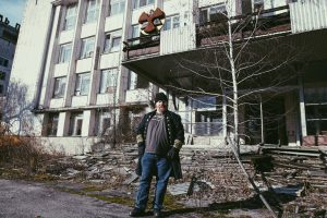 Phil & the not quite AEC building of Pripyat (photo by Robyn von Swank, 2016)